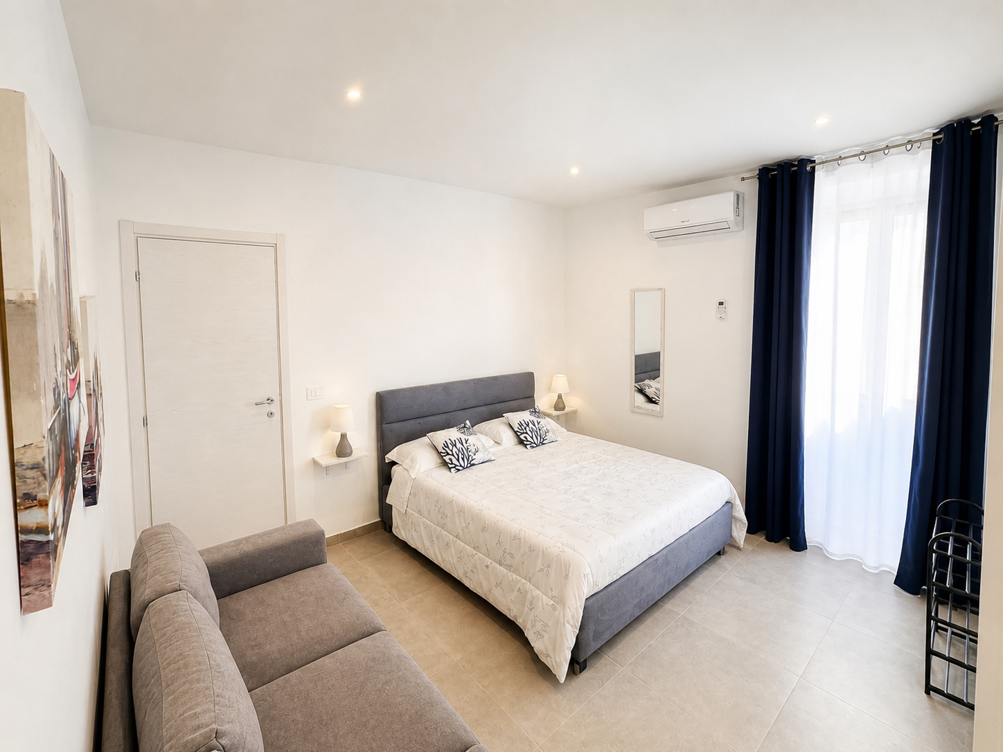 Bedroom with sofa and natural light
